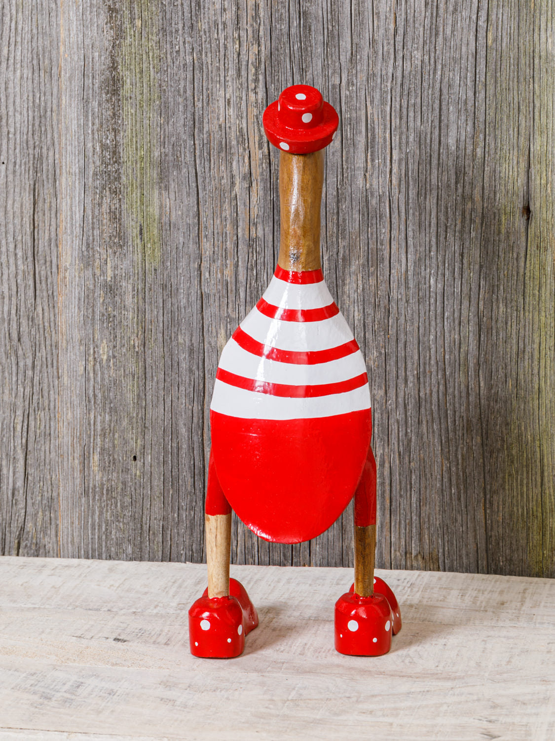 Ente aus Holz rot geringelter Badeanzug