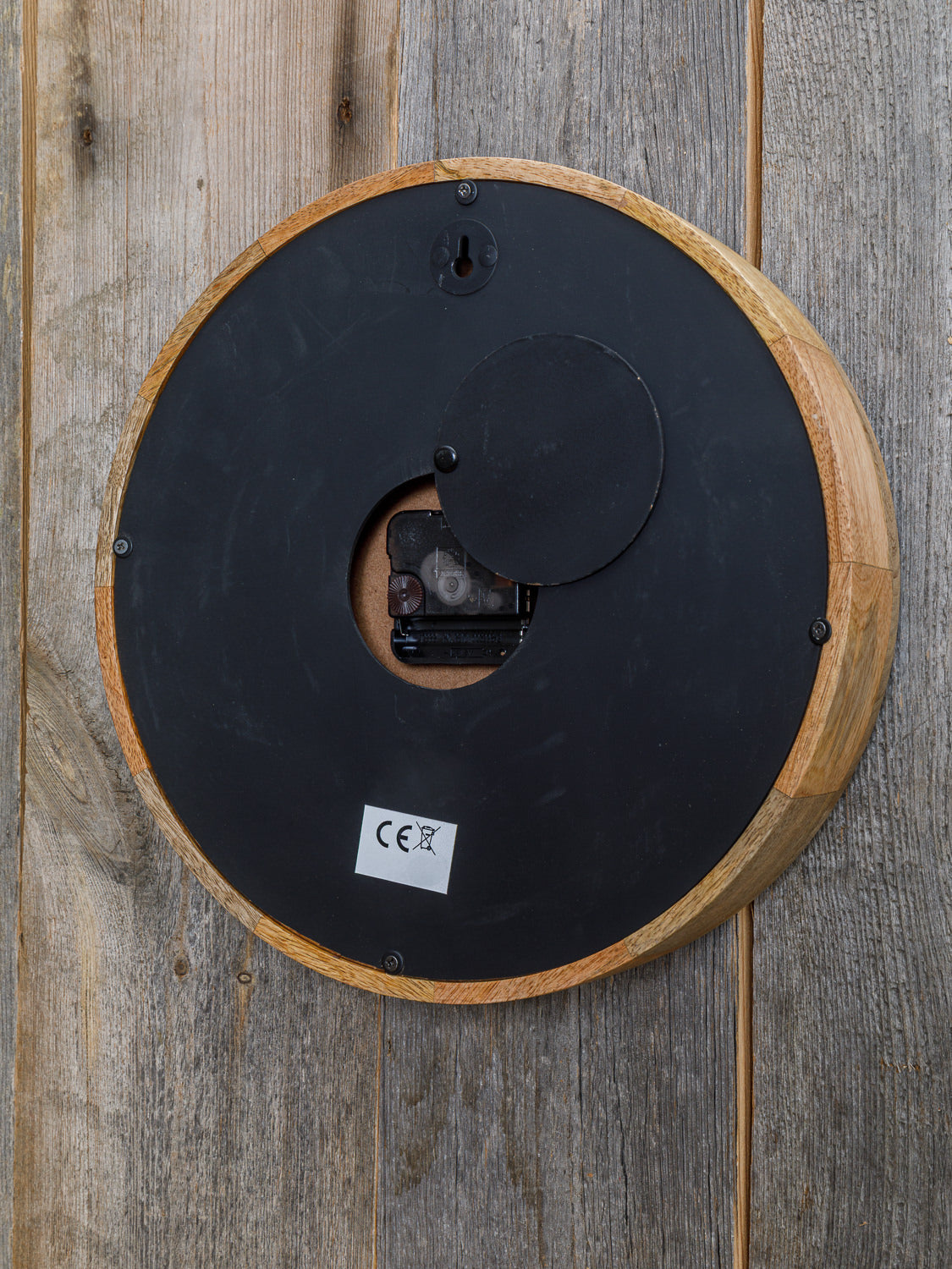 Runde Wanduhr Mangoholz Walflosse