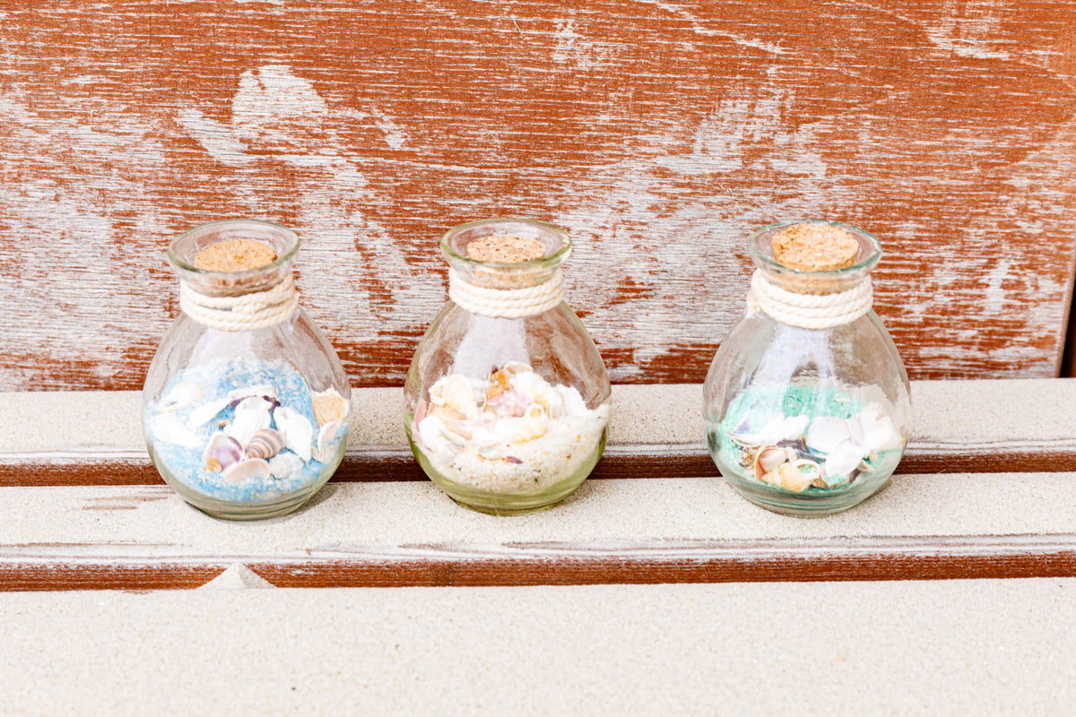 Flasche Sand Muscheln rund